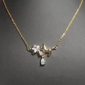Elegant Gold Necklace with Cat and Star Design
